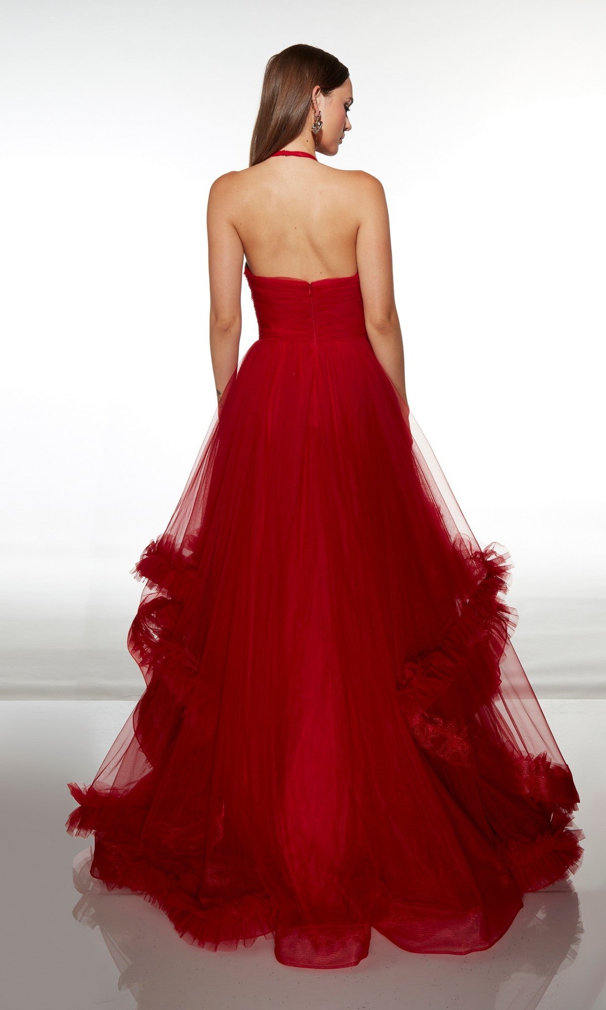 A woman stands with her back to the camera against a plain white background, elegantly displaying the strapless, floor-length red tulle Long Formal Dress: Alyce 62151.